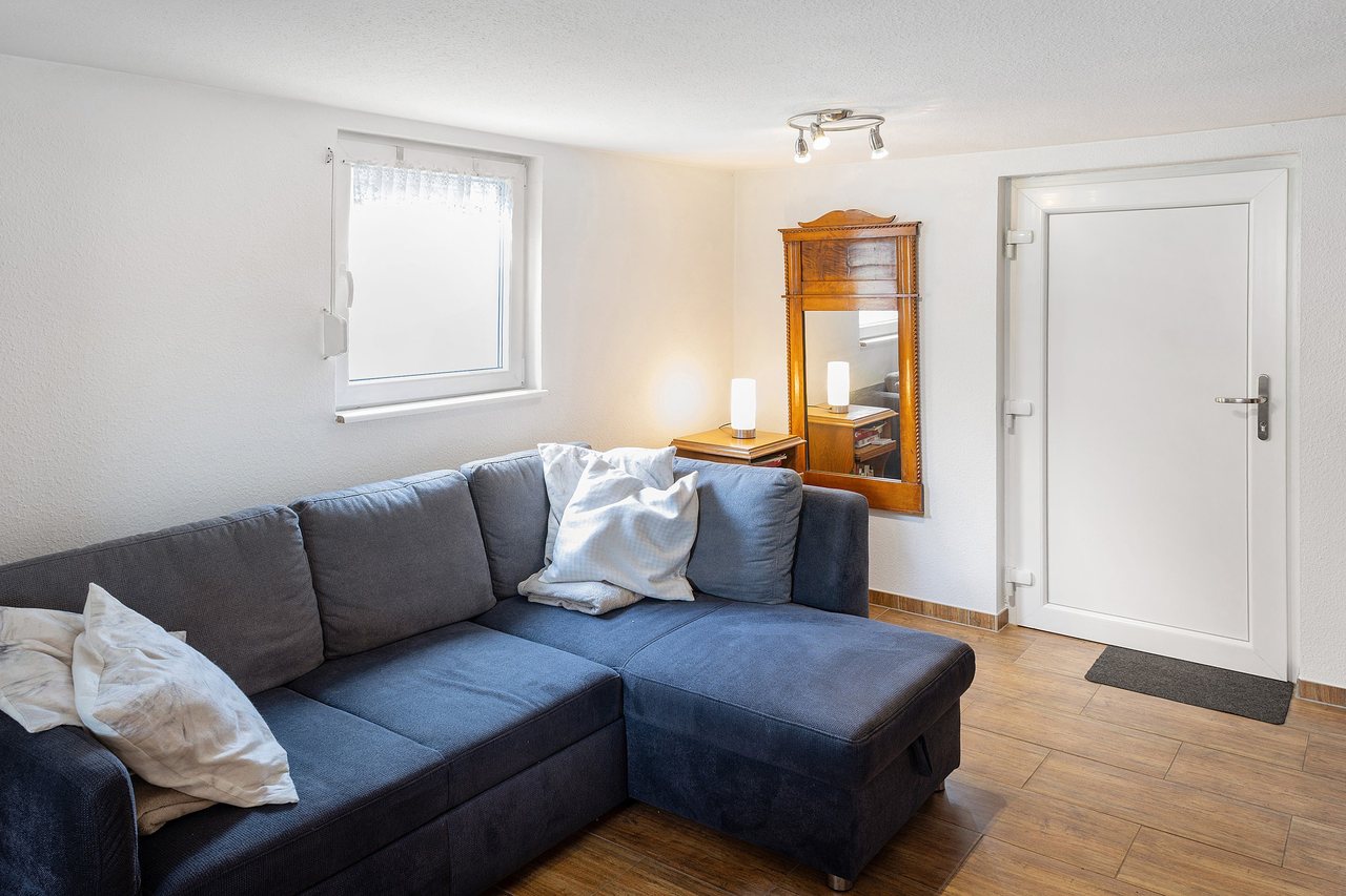 Wohnzimmer mit Ecksofa, Ferienhaus Am Schwielochsee 1 in Schwielochsee, Brandenburg