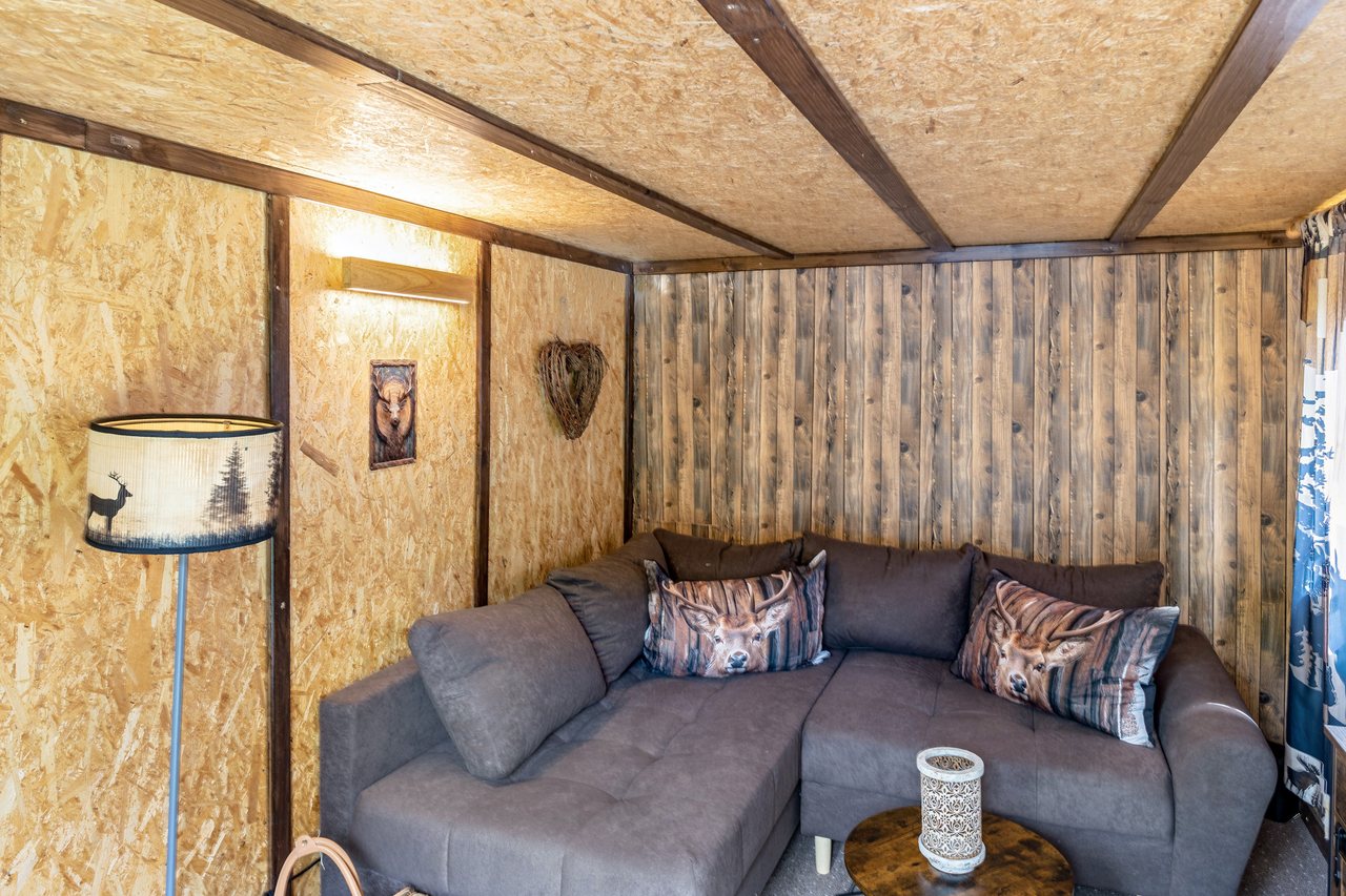 Sitzecke mit Ecksofa, Ferienhaus Obert in Drognitz, Thüringen